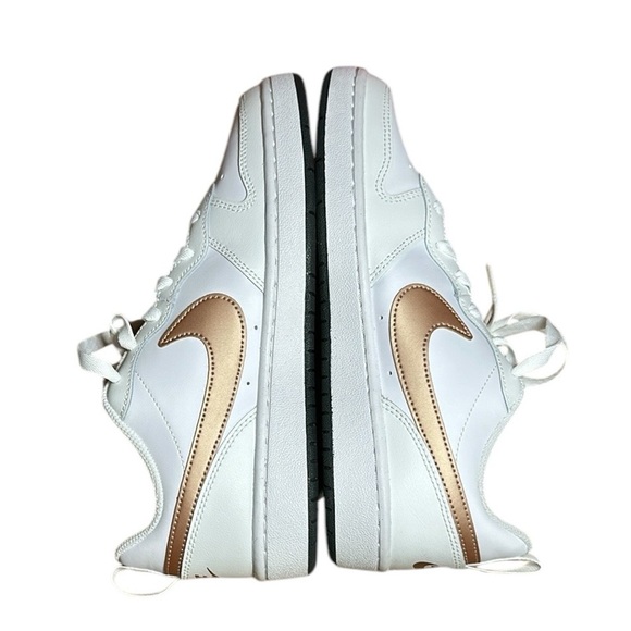 white nike sneakers with rose gold swoosh